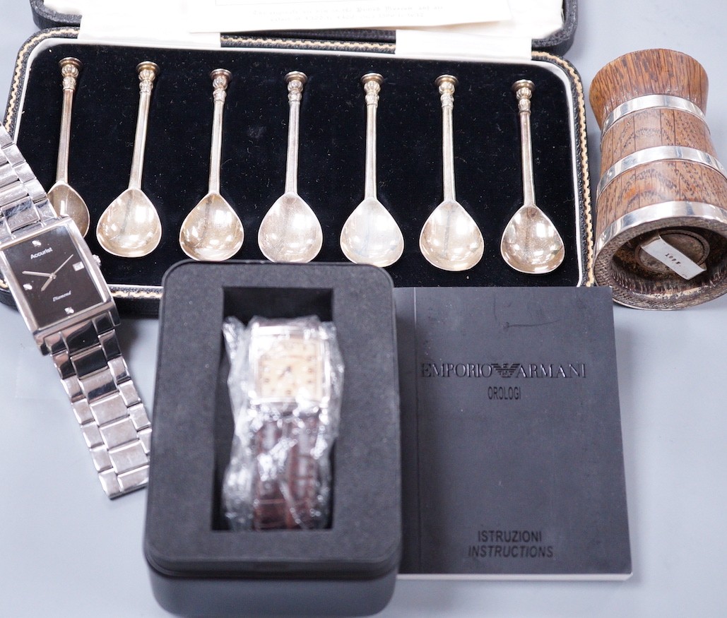 A cased set of eight George VI silver 'The Salisbury Seal Top' coffee spoons, J. Sidney Rumbridge, Sheffield, 1938, a late Victorian silver mounted wooden pepper mill and two gentleman's modern wrist watches.